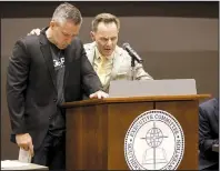  ?? AP/JON SHAPLEY ?? J.D. Greear (left), president of the Southern Baptist Convention, and Ronnie Floyd, president and CEO of the SBC Executive Committee, pray during a meeting Monday at the group’s conference in Birmingham, Ala.