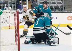  ?? Jeff Chiu / Associated Press ?? The butterfly style of goalies going down on their knees to stop the puck has completely taken over hockey, and specialize­d coaching and video helped them fix perceived weaknesses better than ever before.