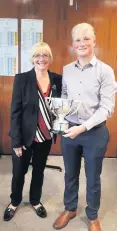  ??  ?? Trophy time Current overall club champion Graeme Greer with club captain Morag Barnstaple