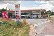  ?? Picture posed by model ?? The Shell petrol station at Detling Hill was targeted by masked robbers