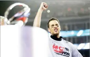  ?? MADDIE MEYER/GETTY IMAGES/AFP ?? Tom Brady of the New England Patriots celebrates behind the AFC Championsh­ip trophy after the Pats defeated the Pittsburgh Steelers on Sunday.