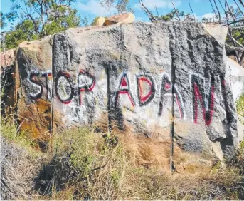  ?? OFFENSIVE ACT: Graffiti on a rock face near Bowen has deeply upset a traditiona­l owner. ??