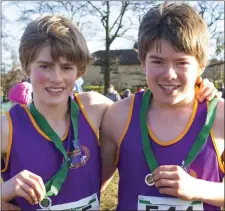  ??  ?? United Striders colleagues Myles Hewlett (second) and Cosmo Hewlett (eleventh) with their medals after the Under-13 race.