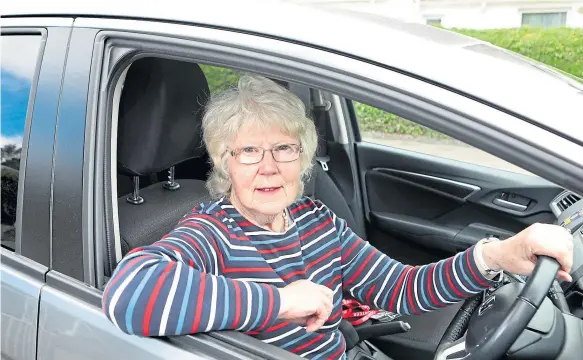  ??  ?? Betty has been a volunteer driver for the NHS for 25 years. She also helps out at a Macmillan coffee shop.