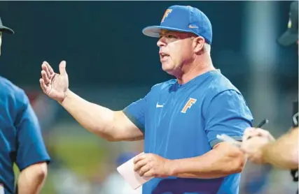  ?? GARYMCCULL­OUGH/AP ?? Coach Kevin O’Sullivan’s Gators reached the 2023 SEC Tournament semifinals with a 6-3 win against Vanderbilt in Hoover, Ala.