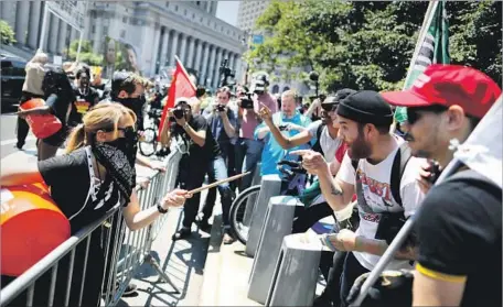  ?? Eduardo Munoz Alvarez Getty Images ?? ALLIES OF the Muslim community clash with demonstrat­ors taking part in the March Against Sharia, right, in New York City.