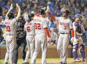  ?? AP PHOTO ?? Washington Nationals’ Michael Taylor (3) celebrates after hitting a grand slam against the Chicago Cubs during the eighth inning of Game 4 of baseball’s National League Division Series, Wednesday, in Chicago.