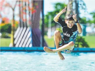  ?? BOMBS AWAY: Dartanyan Gottani, 11, splashes into summer at Riverway. Picture: ZAK SIMMONDS ??