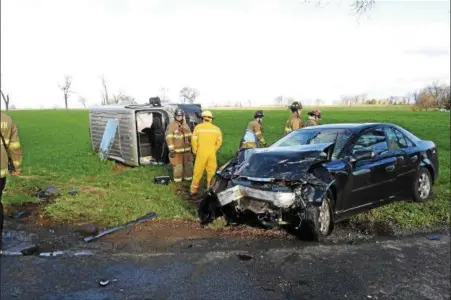  ?? SUBMITTED PHOTO - DAVID J. REIMER SR., EMERGENCY SERVICES PHOTOGRAPH­Y ?? A car collided with the side of a van, flipping the van on its side and trapping the driver inside at 7:38 a.m. on Friday, April 20. Fleetwood Police Department responded to the scene at Schiery Road and Schuler Road, Richmond Township. There were...