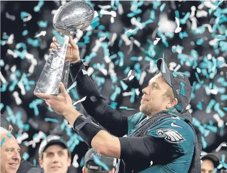  ?? Picture: PA. ?? Eagles quarterbac­k Nick Foles lifts the Vince Lombardi Trophy after Super Bowl LII in Minneapoli­s.
