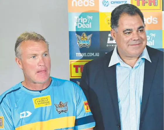  ?? Picture: AAP IMAGE ?? Titans coach Garth Brennan (left) listens as Mal Meninga is appointed to the Gold Coast club yesterday.