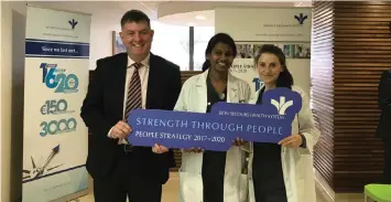  ??  ?? John McPhillips with Galway Hospital staff embracing ‘Strength through People’