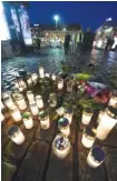  ?? THE ASSOCIATED PRESS ?? Memorial candles were placed at the Market Square for the victims of Friday’s stabbings in Turku, Finland, on Friday evening.