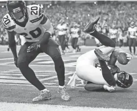  ?? GETTY IMAGES ?? Mohamed Sanu catches a 3-yard touchdown pass from Matt Ryan to put Atlanta up, 36-13.