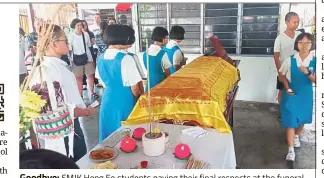  ??  ?? Goodbye: SMJK Heng Ee students paying their final respects at the funeral of their schoolmate in Penang.