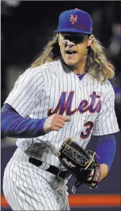  ?? Julie Jacobson ?? The Associated Press New York Mets starter Noah Syndergaar­d, who has been on the disabled list since April with a lat injury, will throw his first bullpen session on Tuesday.