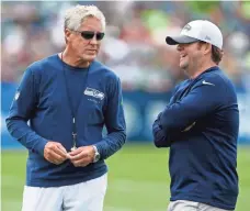  ?? JOE NICHOLSON, USA TODAY SPORTS ?? Coach Pete Carroll, left, and general manager John Schneider are the brains behind the Seahawks’ success.