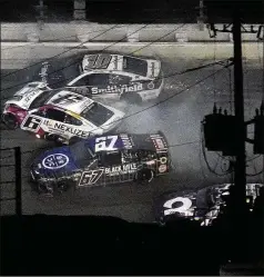  ?? CHRIS O’MEARA / ASSOCIATED PRESS ?? Travis Pastrana (67), Brad Keselowski (6) and Aric Almirola (10) crash during the Daytona 500 on Sunday. For Keselowski, it was another disappoint­ing try at winning “The Great American Race.”