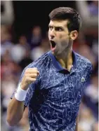  ?? JULIO CORTEZ/AP ?? Novak Djokovic won the U.S. Open for the third time, giving him 14 Grand Slam titles in his career.