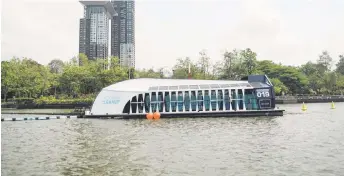  ?? — AFP photo ?? The Ocean Cleanup’s Intercepto­r which captures floating plastic and trash before it reaches the ocean is seen during a press visit on the Chao Phraya river in Bangkok.