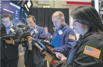  ?? NYSE VIA AP ?? Traders and specialist­s at the New York Stock Exchange last week. The S&P 500 index has had five straight down weeks, its longest such streak in more than a decade.