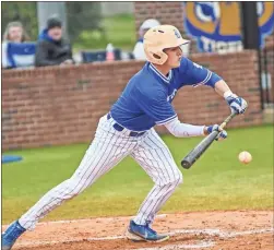  ?? Courtney Couey, Ringgold Tiger Shots ?? Chase Ghormley squares around to bunt during a recent home game. The Tigers have won their first four games in Region 6-AAA play.