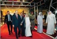  ?? AP ?? Turkey’s President Recep Tayyip Erdogan (second left) walks Sunday with Kuwait’s emir, Sheikh Sabah Al Ahmad Al Sabah (center) before their meeting in Kuwait City.