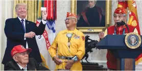  ?? (Reuters) ?? US PRESIDENT Donald Trump meets with Navajo veterans in the White House on Monday.