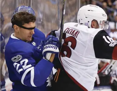  ?? BERNARD WEIL/TORONTO STAR ?? Leaf Nikita Zaitsev was flying blind after losing his lid in a collision with Max Domi of the Coyotes in Monday night’s encounter at the Air Canada Centre. Domi’s teammate, rookie Clayton Keller, is already turning heads around the NHL. More, S4