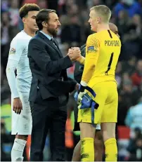  ?? AP ?? England manager Gareth Southgate shakes hands with goalkeeper Jordan Pickford at the end of the Nations League match. —