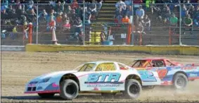  ?? JOHN BREWER – ONEIDA DAILY DISPATCH ?? Fans fill the bleachers to watch a race on opening day at Utica-Rome Speedway in Vernon on Sunday, April 23, 2017. This year’s opening race will be Sunday, May 6, 2018.