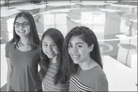  ?? NWA Democrat-Gazette/ANTHONY REYES @NWATONYR ?? Springdale High School seniors (from left) Diana Lobaton, Stephanie Trejo Corona and Carol Medina, at their school Wednesday in Springdale. The seniors were accepted into the QuestBridg­e program and received scholarshi­ps for college. Medina will attend...