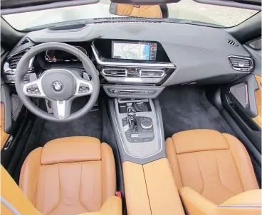  ??  ?? The 2019 BMW Z4 has an iDrive infotainme­nt system with a 10.25-inch touch screen.