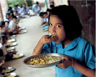  ??  ?? Mid-day meal at a school in Ganjam