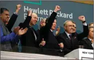  ?? (AP) ?? Tech giant Hewlett Packard Enterprise President & CEO Antonio Neri (right) rings the New York Stock Exchange opening bell on Oct. 24, 2018. Hewlett Packard Enterprise moved its global headquarte­rs to Spring, Texas from California in 2020.