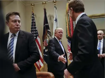  ?? Pablo Martinez Monsivais/Associated Press ?? Donald Trump and Elon Musk, CEO of SpaceX and Tesla Motors, left, at a breakfast with business leaders in the Roosevelt Room of the White House, Jan. 23, 2017.