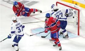  ?? Quebec. Photograph: Mark Blinch/Getty Images ?? Josh Anderson of the Montreal Canadiens scores the game-winning goal in overtime past Andrei Vasilevski­y of the Tampa Bay Lightning in Game 4 of the Stanley Cup final at the Bell Centre in Montreal,