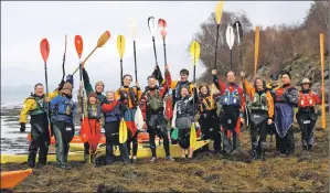  ??  ?? Kayakers from Mid Argyll have come together to show their opposition to the fish farm applicatio­n in the Sound of Jura.