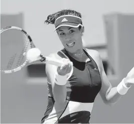  ?? LYNNE SLADKY/AP ?? Garbine Muguruza, of Spain, makes a forehand return against Sloane Stephens during their match Monday.