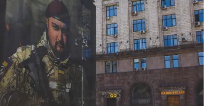  ?? (Valentyn Ogirenko/Reuters) ?? A BANNER advertisin­g contract military service in the Ukrainian Armed Forces is seen in central Kyiv, amid Russia’s attack on Ukraine, last month.