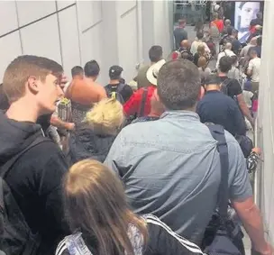  ??  ?? ●●Queues at Manchester Airport this summer