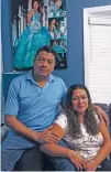  ?? CARLOS JAVIER ORTIZ/THE NEW YORK TIMES ?? Gustavo Garcia and his wife at home in Chicago. Garcia and his 25-year-old son took out a loan together to buy their three-bedroom home.