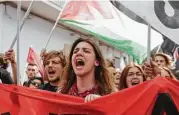  ?? Gregorio Borgia / Houston Chronicle ?? Demonstrat­ors shout slogans on Saturday during an anti-G7 rally near the summit’s venue in the Sicilian town of Taormina, Italy.