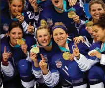  ?? BRUCE BENNETT / GETTY IMAGES ?? The gold-medal winning United States women’s hockey team celebrates Wednesday after defeating Canada in a shootout at the PyeongChan­g 2018 Winter Olympic Games.