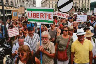  ?? Bob Edme / Associated Press ?? French protesters in Bayonne show their opposition last month to COVID-19 health passes needed to access restaurant­s, hospitalit­y venues, cultural sites and domestic travel.