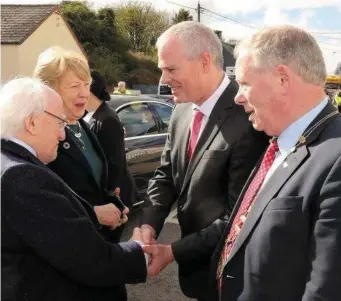  ??  ?? President Higgins is welcomed to Ballisodar­e by Council CEO Ciaran Hayes and Council Cathaoirle­ach, Cllr Seamus Kilgannon last Friday afternoon at the bridge renaming ceremony.
