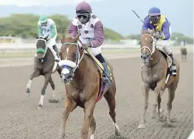  ??  ?? AMERICAN INVADER (Omar Walker) wins the Terremoto Trophy race over 1000 metres round at Caymanas Park on Saturday, September 1, 2018.