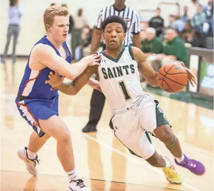  ?? ARIEL COBBERT/THE COMMERCIAL APPEAL ?? Briarcrest’s Kennedy Chandler (1) drives to the basket against MUS on Feb. 14.