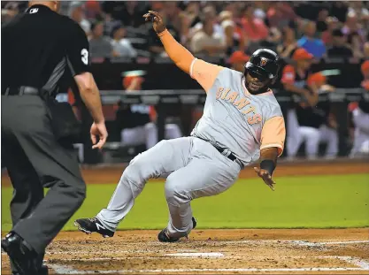  ?? NORM HALL — GETTY IMAGES ?? The Giants’ Pablo Sandoval scores during the second inning on a double by Nick Hundley against the Arizona Diamondbac­ks.