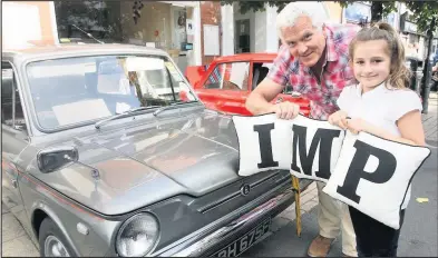  ??  ?? Carmella Trowell from Hinckley with Barry Cole from Sileby with his Sumbeam Imp and car cushions that spell out the name at last year’s show. Picture: Ted Cottrell